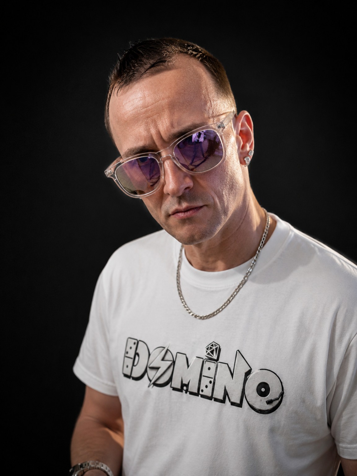 DJ Domino in his white Domino shirt and sunglasses